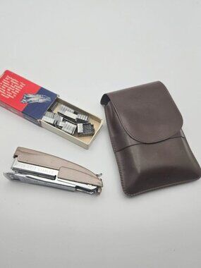 Vintage early 60s swingline deluxe tot mini stapler, staples, and case.